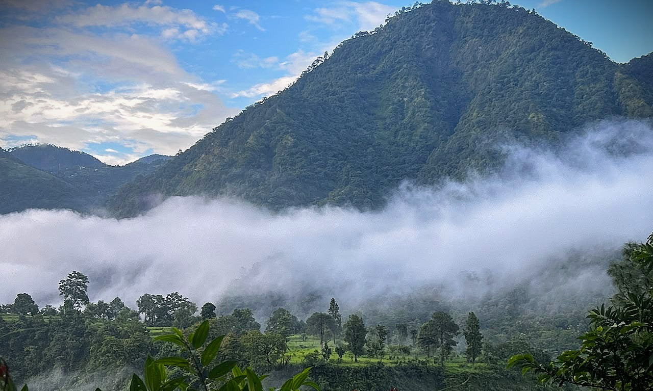 A misty mountain landscape home of Aparajita